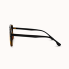 Sunglasses with a tortoiseshell frame on a white background