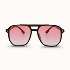 Sunglasses with pink gradient lenses on a white background