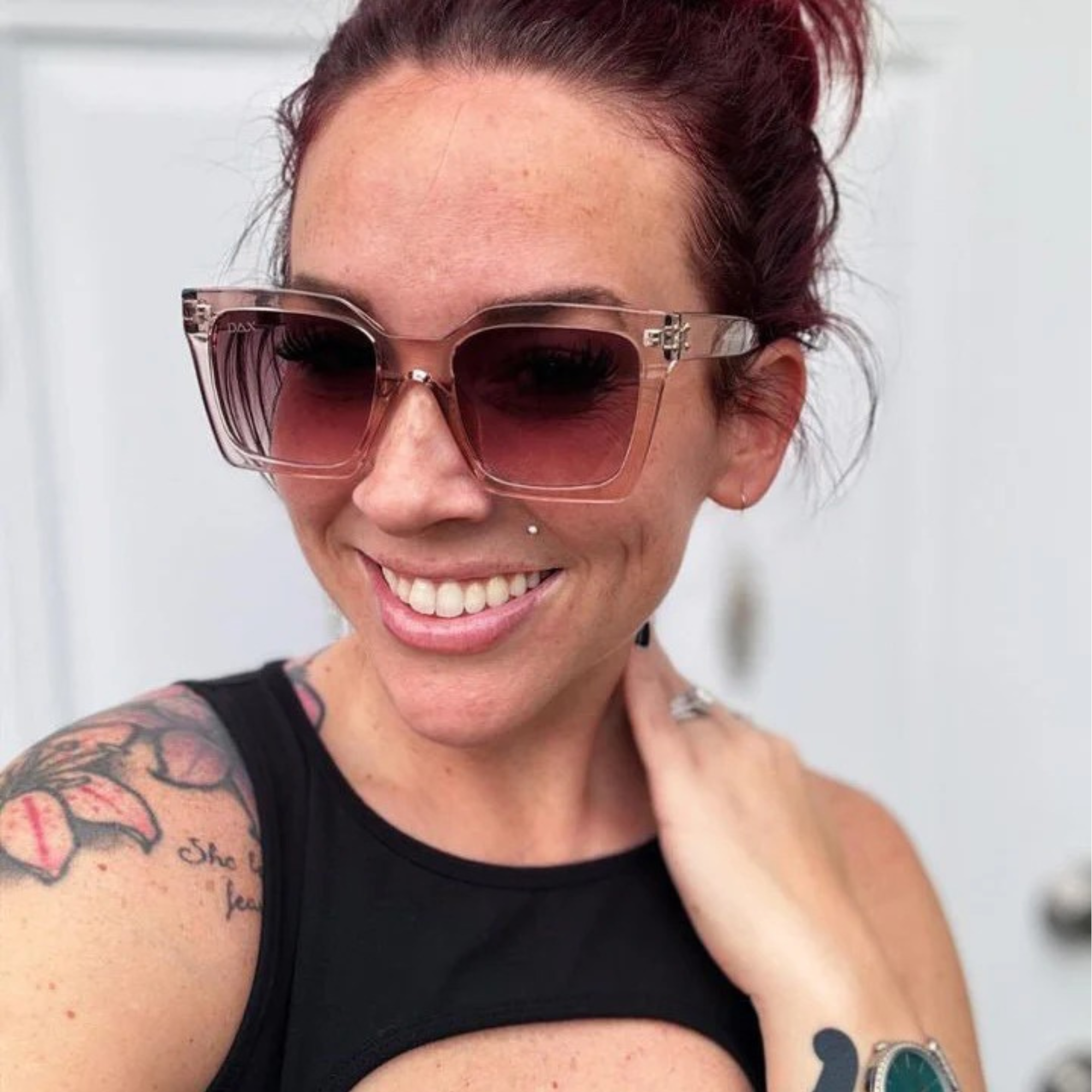 Woman wearing sunglasses with a blurred background