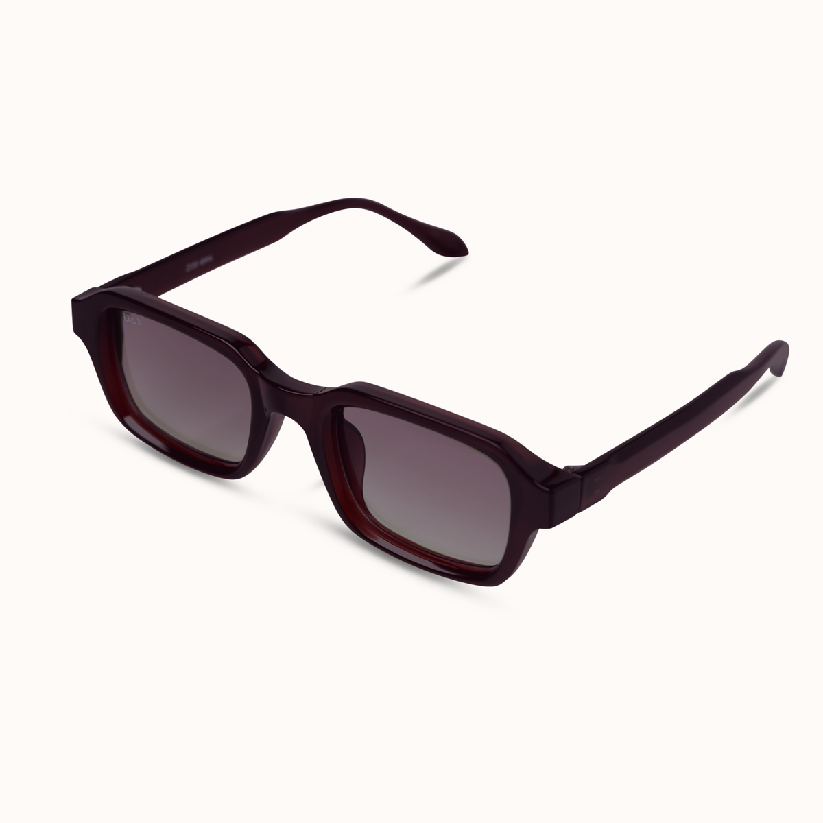 A pair of square-frame sunglasses with a translucent dark burgundy acetate frame and dark gray gradient lenses, shown on a clean off-white background.