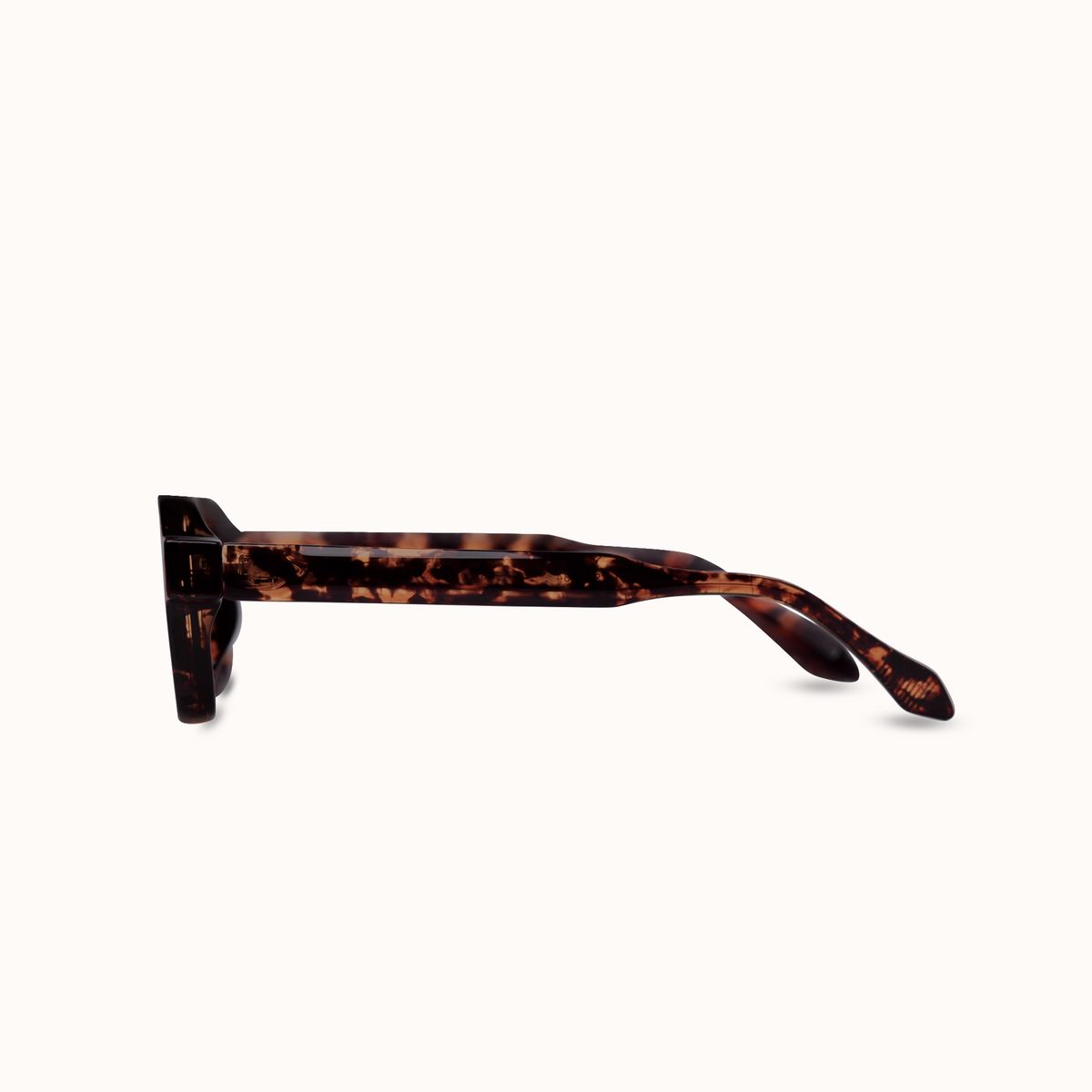 A pair of tortoiseshell sunglasses shown in a side profile view against a solid off-white background.